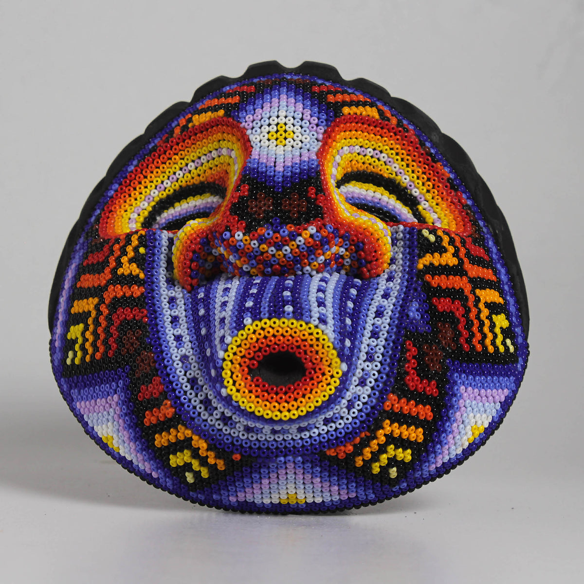 Máscara Silbando – Redonda 15 cm, Violeta y Naranja
