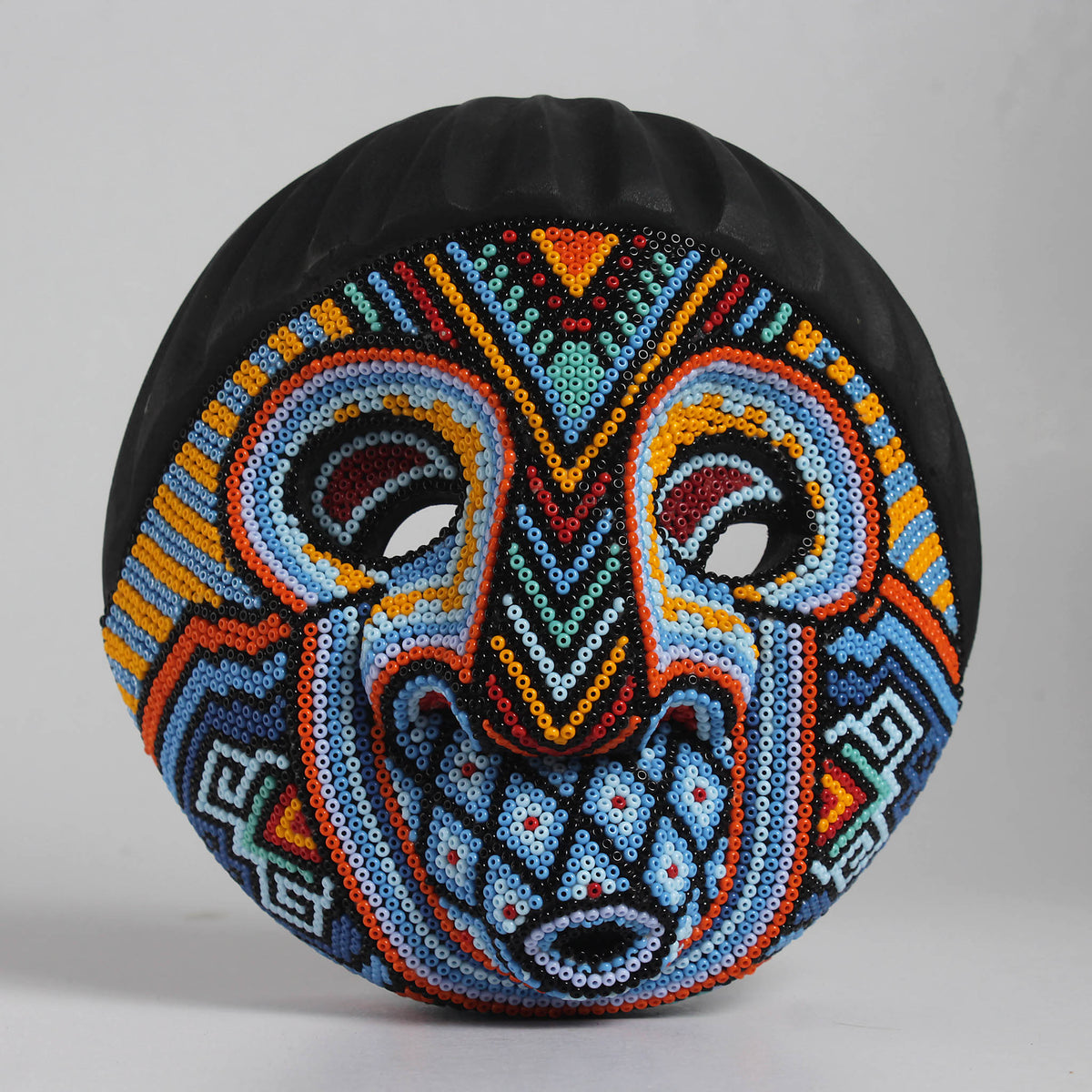 Máscara Silbando – Redonda 15 cm, Azul Celeste y Naranja