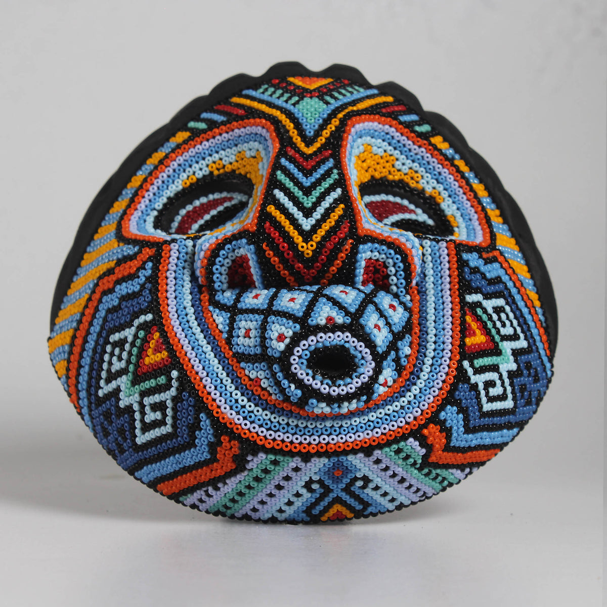 Máscara Silbando – Redonda 15 cm, Azul Celeste y Naranja