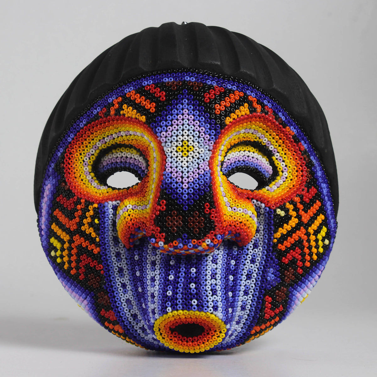 Máscara Silbando – Redonda 15 cm, Violeta y Naranja