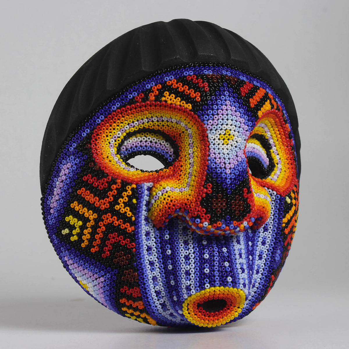 Máscara Silbando – Redonda 15 cm, Violeta y Naranja